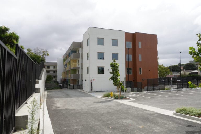 vertical siMilgard windows and aluminum siding on Vista Wood multifamily buildingding for houses