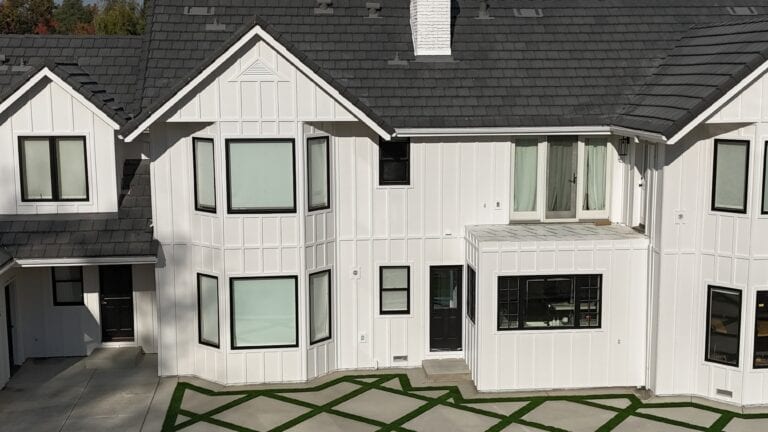 Close-up of James Hardie lap siding with dark window trim on Granite Bay residence