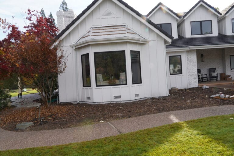 Close-up of James Hardie lap siding with dark window trim on Granite Bay residence