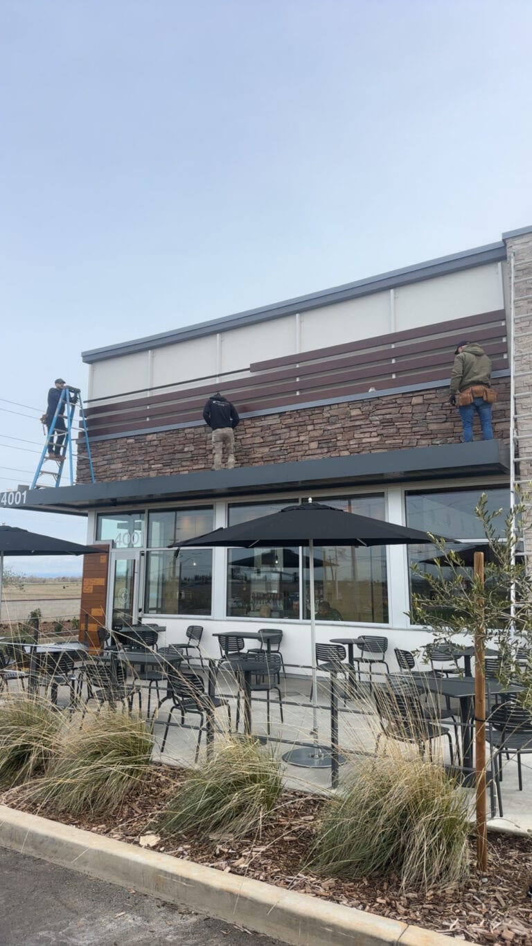 Completed Chipotle exterior with brand signage — commercial siding project by Heritage Exteriors