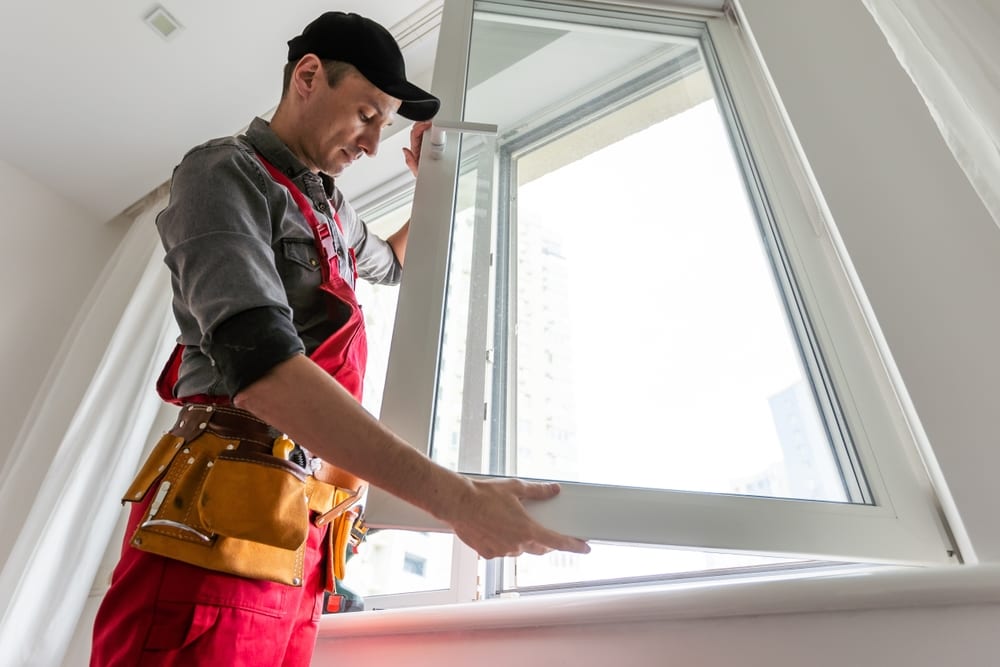 contractor installing window